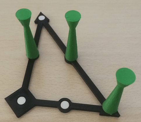 A model consisting of ferrous filament and other components into which magnets are glued in.